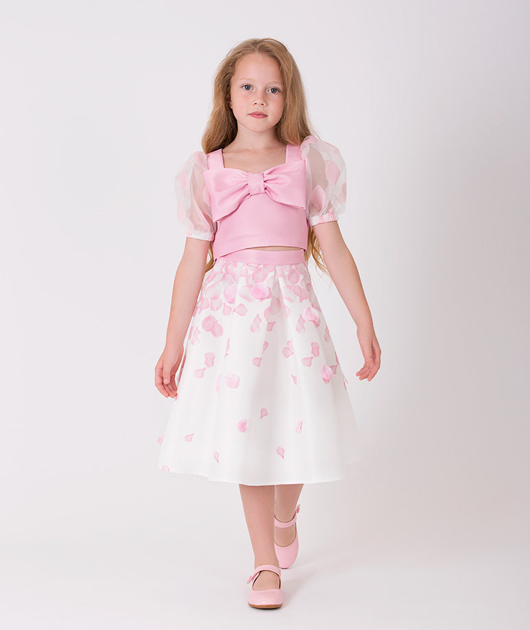 The perfect set of a pink blouse with a bow and balloon sleeves and a 3D rose petal-printed skirt