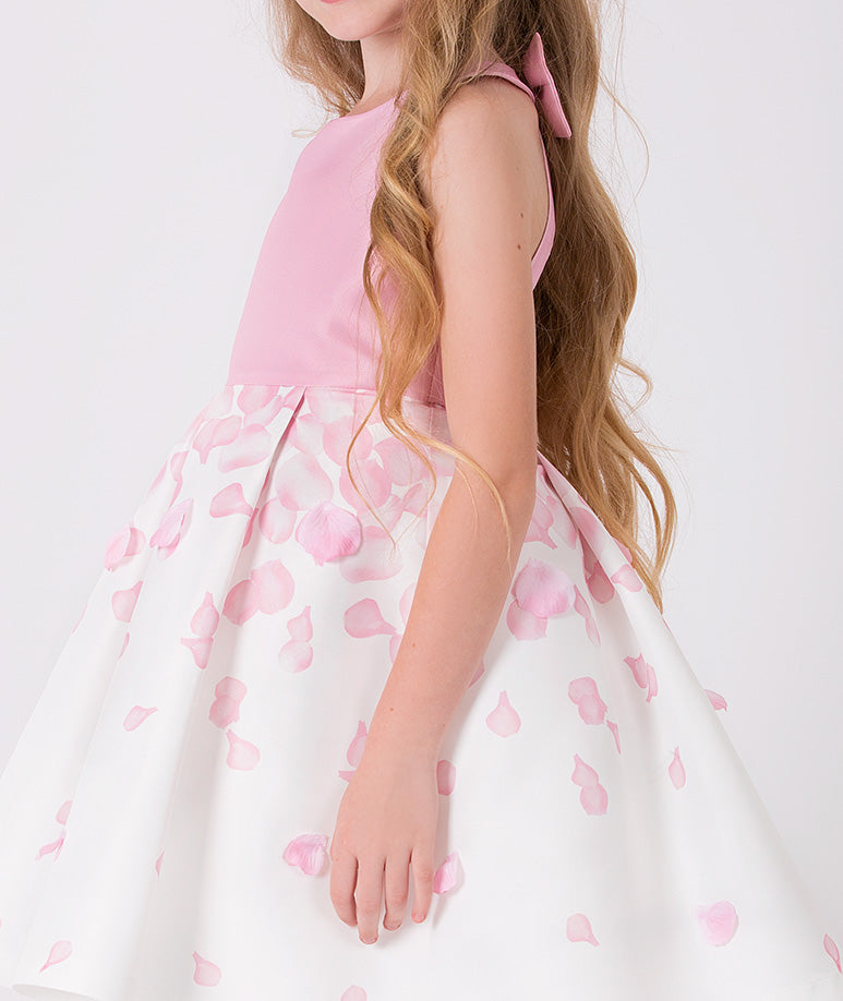 ecru dress with pink top and rose petal prints on the skirt for little girls