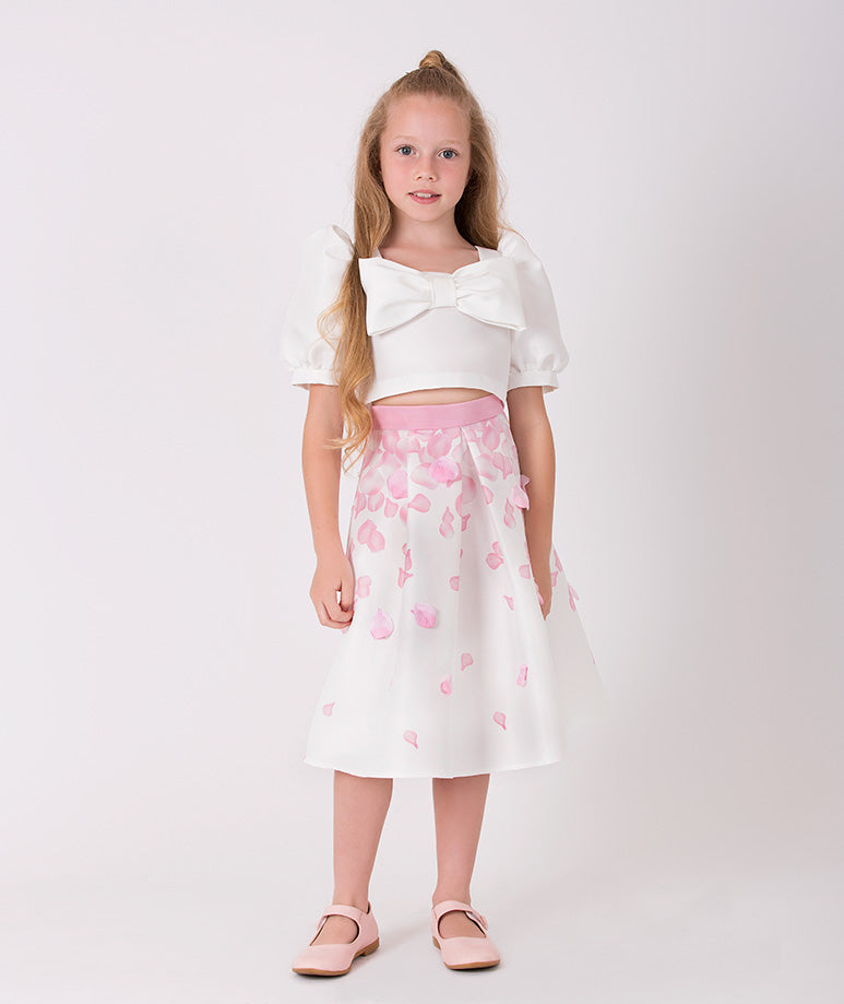 The perfect set of an ecru blouse with a bow and balloon sleeves and a 3D rose petal-printed skirt