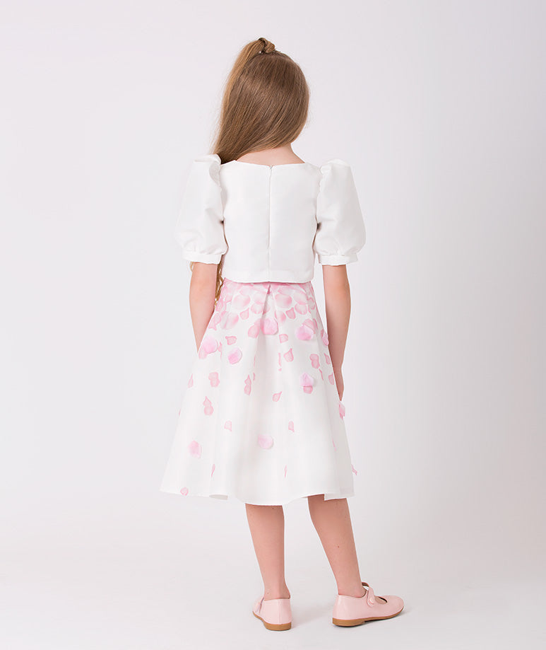 ecru blouse with balloon sleeves and a skirt with pink 3D rose petal prints